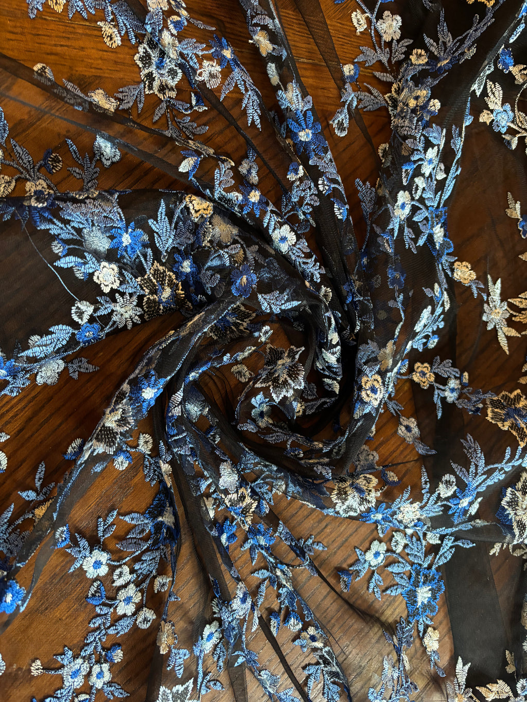 SHADES OF BLUE EMBROIDERED LACE ON BLACK MESH FABRIC
