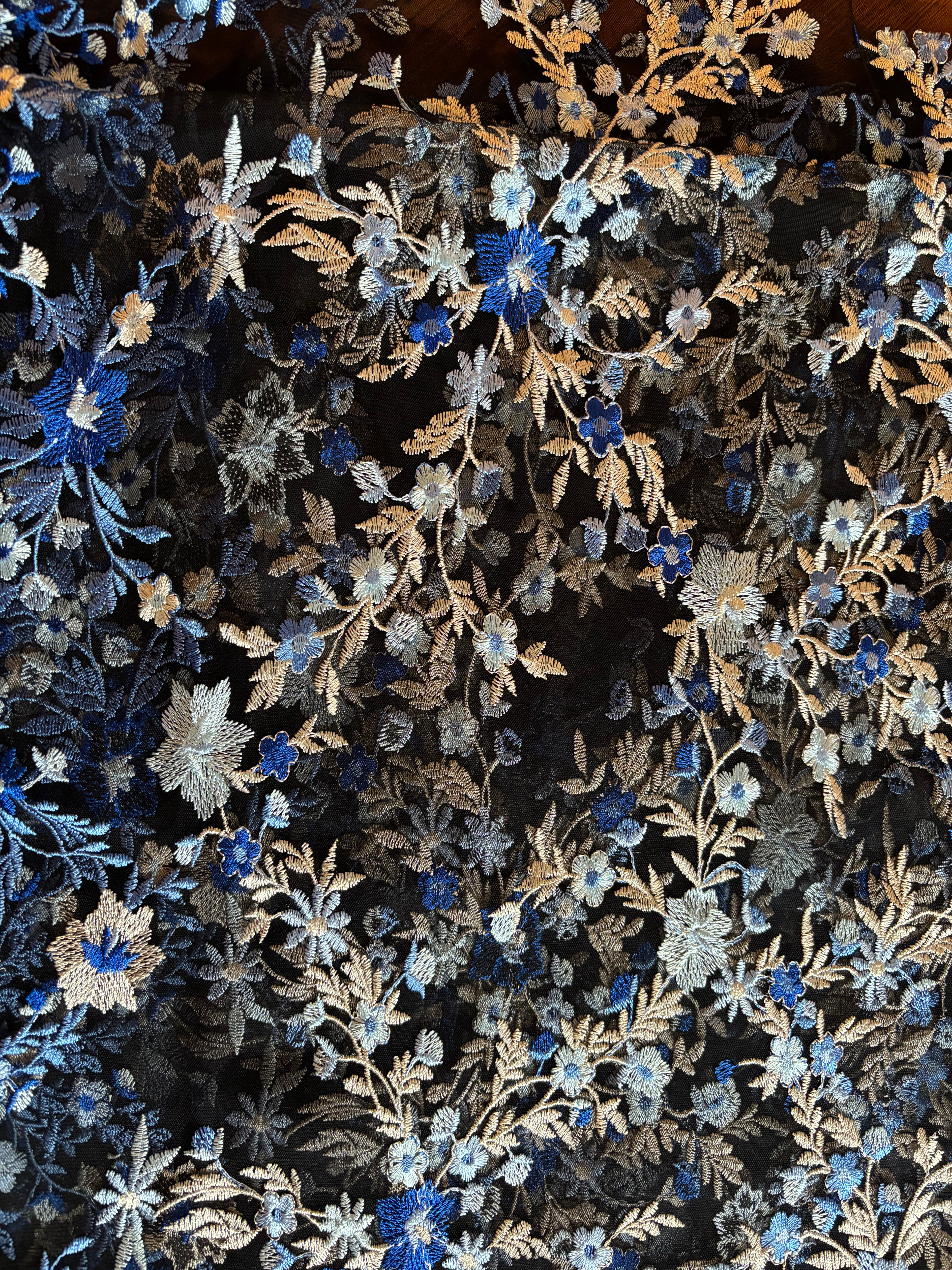 SHADES OF BLUE EMBROIDERED LACE ON BLACK MESH FABRIC