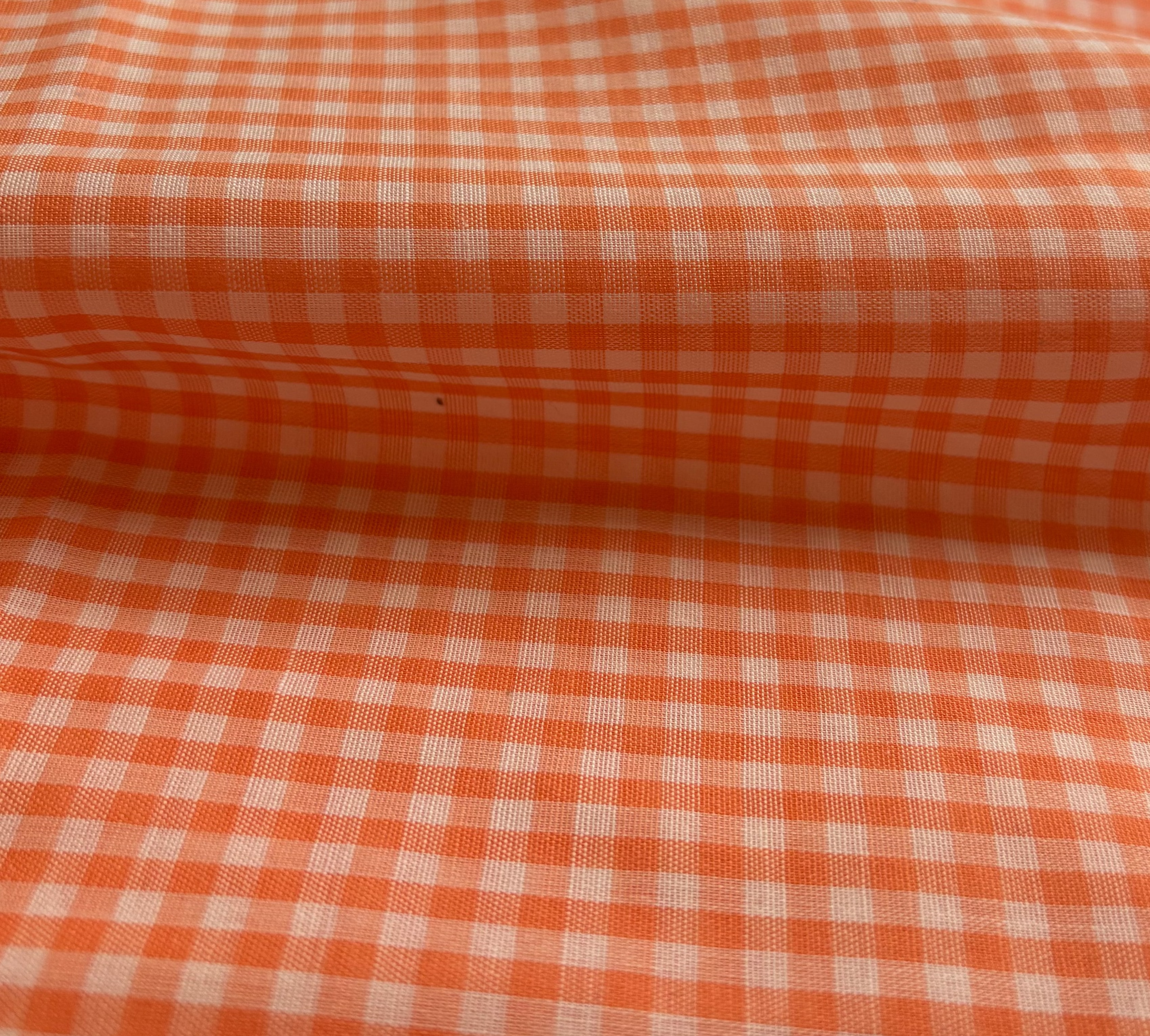 Close-up of orange and white checkered fabric
