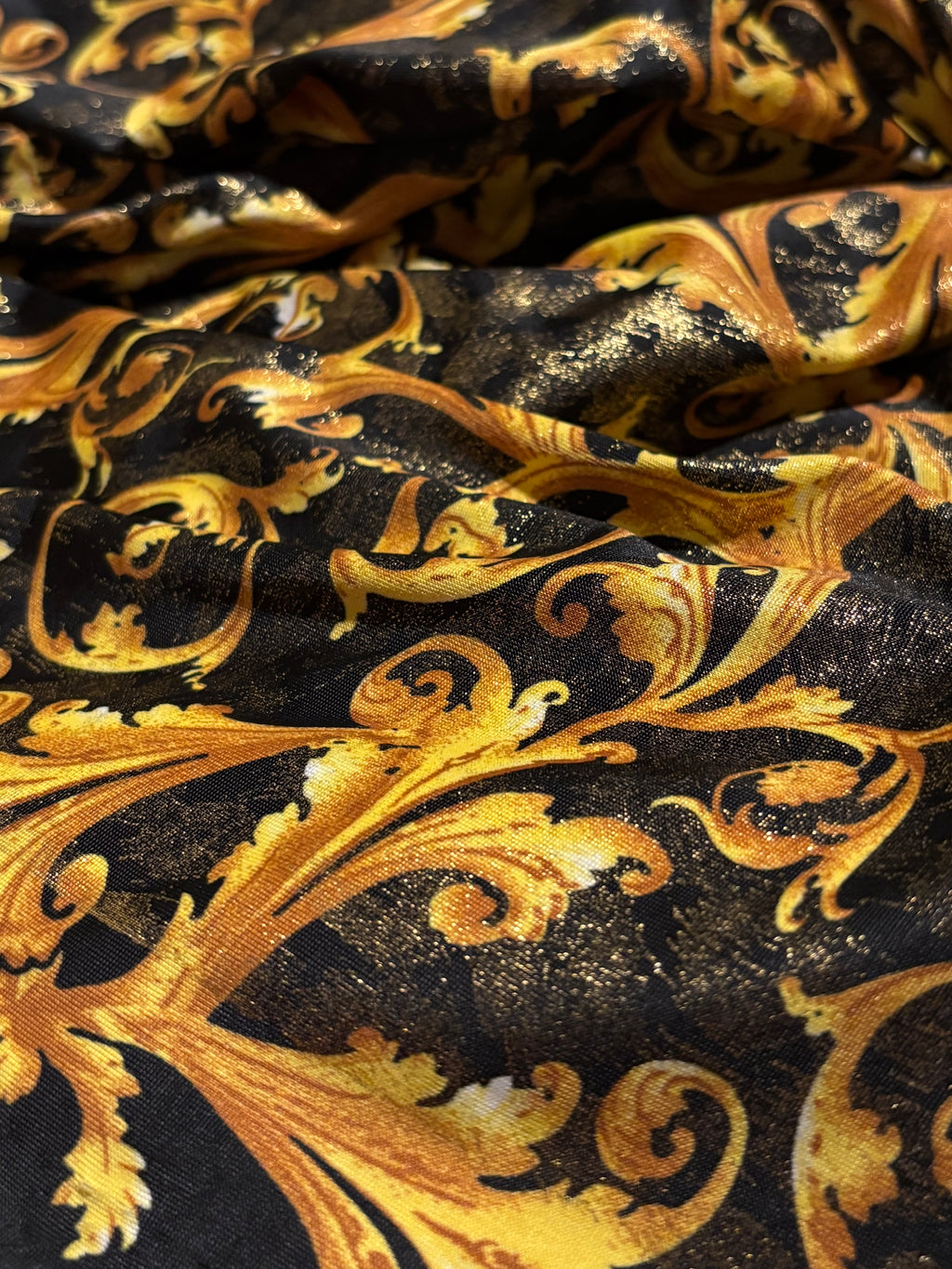 GOLD SCROLLS ON BLACK BACKGROUND