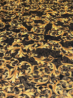 GOLD SCROLLS ON BLACK BACKGROUND
