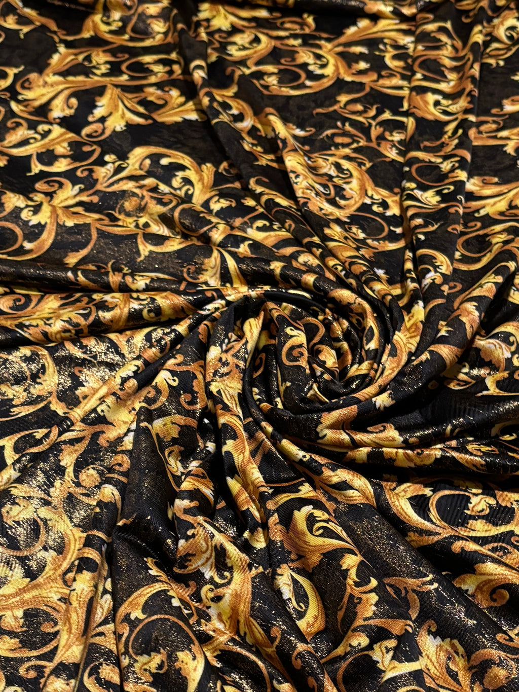 GOLD SCROLLS ON BLACK BACKGROUND