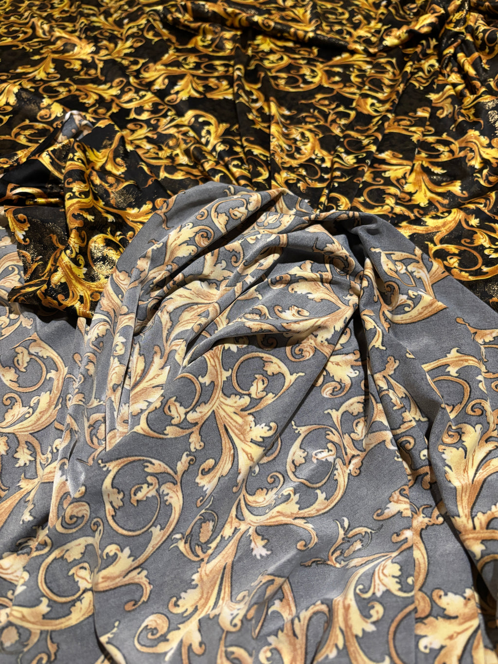 GOLD SCROLLS ON BLACK BACKGROUND