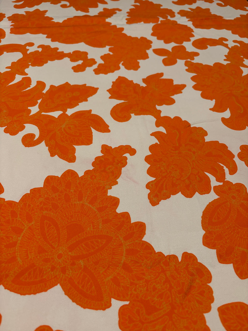 STRETCHY ORANGE FLORALS FROM NYC